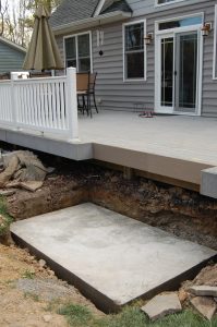 DIY concrete pad deck level outdoor fireplace