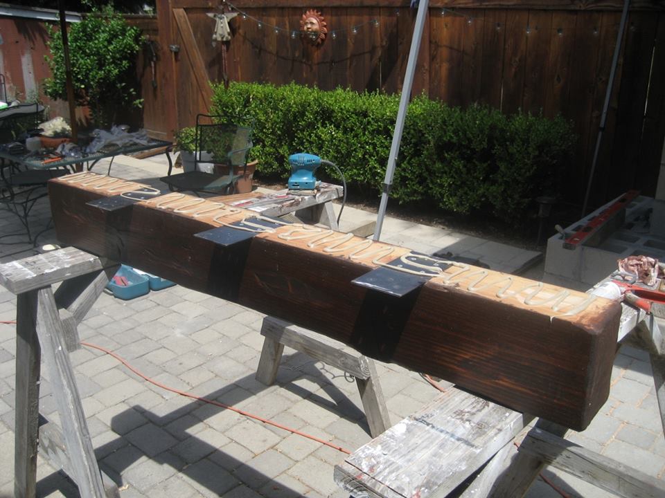 Wood mantel with metal brackets Your DIY Outdoor Fireplace Headquarters