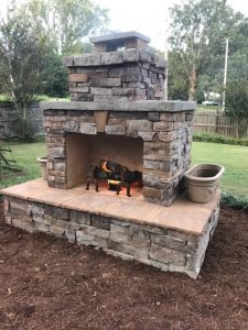 DIY outdoor fireplace mulch backyard grass fire grate planter veneer flagstone chimney