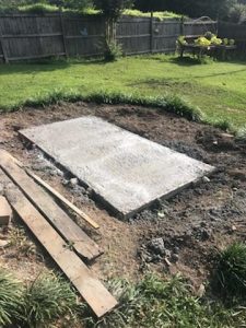 cDIY Concrete slab in backyard with grass wood