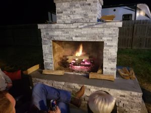 DIY outdoor fireplace with fire