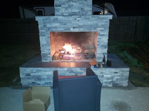 DIY outdoor fireplace with fire